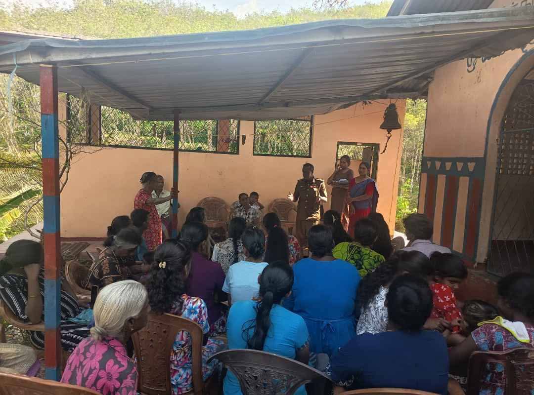 Public health inspector leading a community health guidance session at Narangammana Ambadeniya Estate