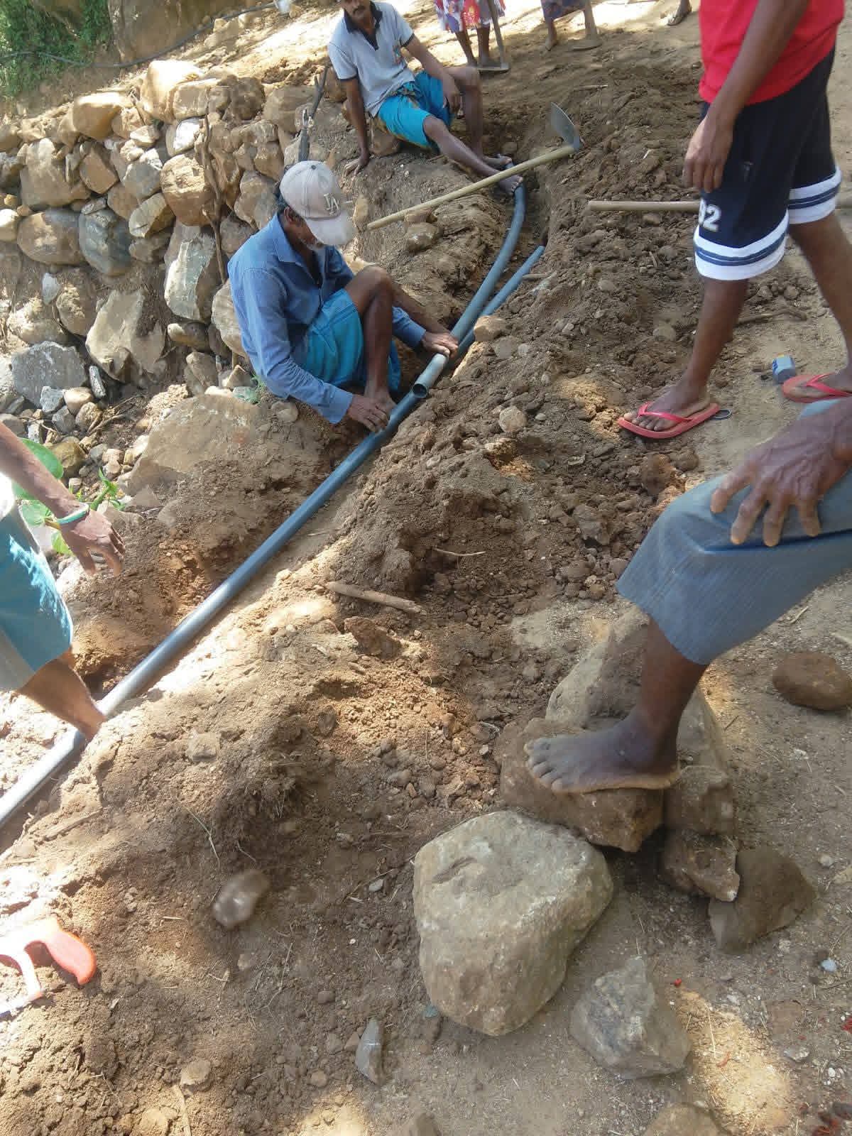 Families in Geradigala benefiting from improved clean water access through the Hing Patuna water supply project