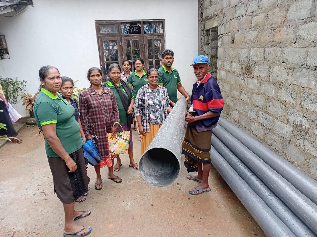 Community members receiving bamboo materials for restoring abandoned paddy fields in Munamalapelessa and Geradigala