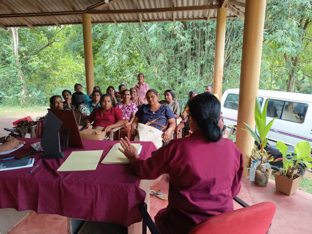 Community food awareness session with families learning about local crops and nutrition